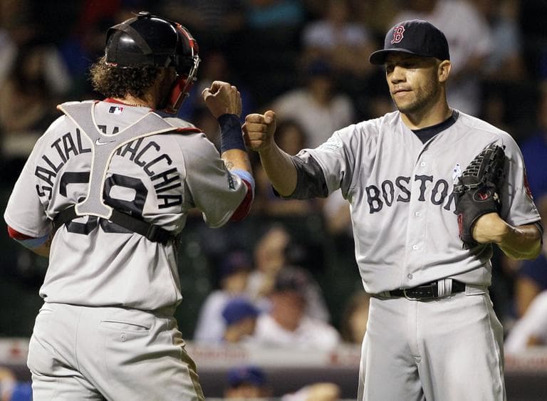 Red Sox closer Alfredo Aceves, right, celebrates with catcher Jarrod Saltalamacchia after defeating the Chicago Cubs 7-4 in Chicago, Sunday. (AP)
