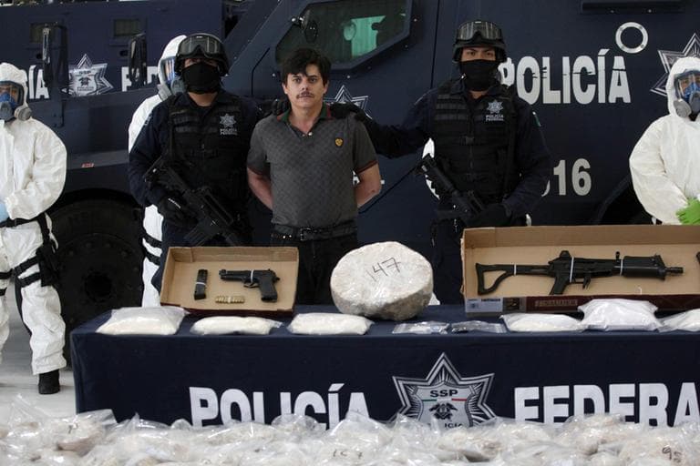 Federal police agents present Jaime Herrera, alias &quot;El Viejito,&quot; alleged member of the Pacific drug cartel, to the press in Mexico City, Tuesday Feb. 14, 2012. (AP)
