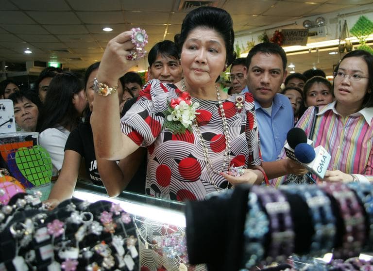 Former Philippine First Lady Imelda Marcos shops after attending the opening of boutiques at the commercial district of Binondo in Manila Thursday Nov. 16, 2006. (AP)