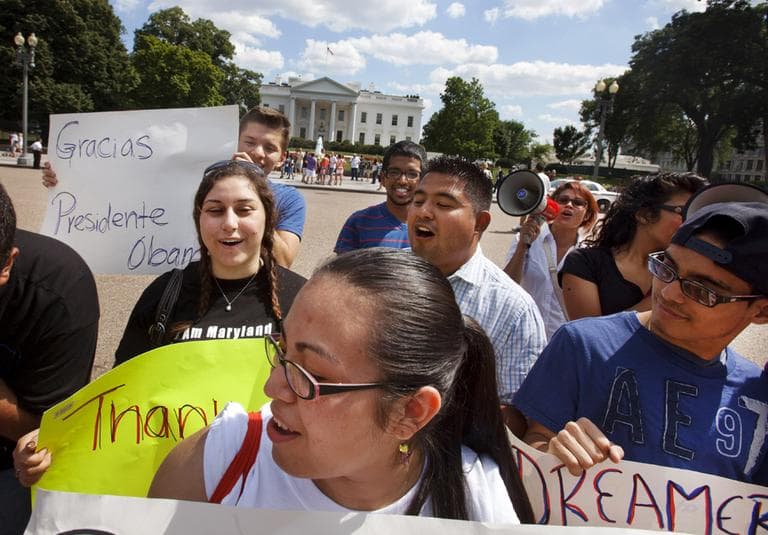 Supporters of President Obama's announcement on immigration policy rally outside the White House Friday. (AP)