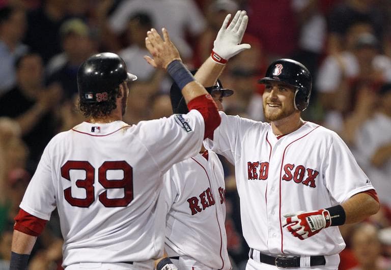 Will Middlebrooks, right, is congratulated by Jarrod Saltalamacchia after his two-run home run against the Miami Marlins in the eighth inning. (AP)