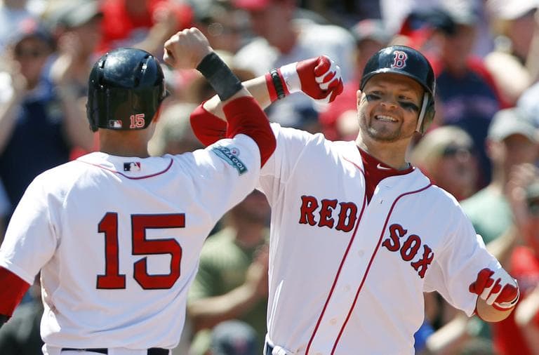 Boston Red Sox's Cody Ross, right, celebrates his three-run home in the fourth inning Sunday. (AP)