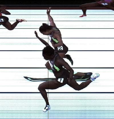 Jeneba Tarmoh (bottom) and Allyson Felix cross the finish line at exactly the same time in the women's 100 meter dash final during Day Two of the 2012 U.S. Olympic Track & Field Team Trials at Hayward Field on June 23, 2012 in Eugene, Oregon. (USTF)