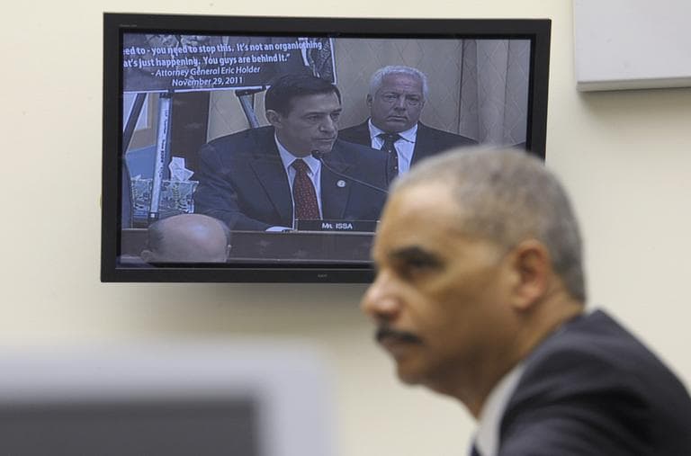 Attorney General Eric Holder listens to Rep. Darryl Issa, R-Calif., on video screen, while testifying on Capitol Hill in Washington, Thursday, Dec. 8, 2011, before the House Judiciary Committee hearing on Operation Fast and Furious. The House voted to find Holder in contempt on June 28, 2012. (AP)