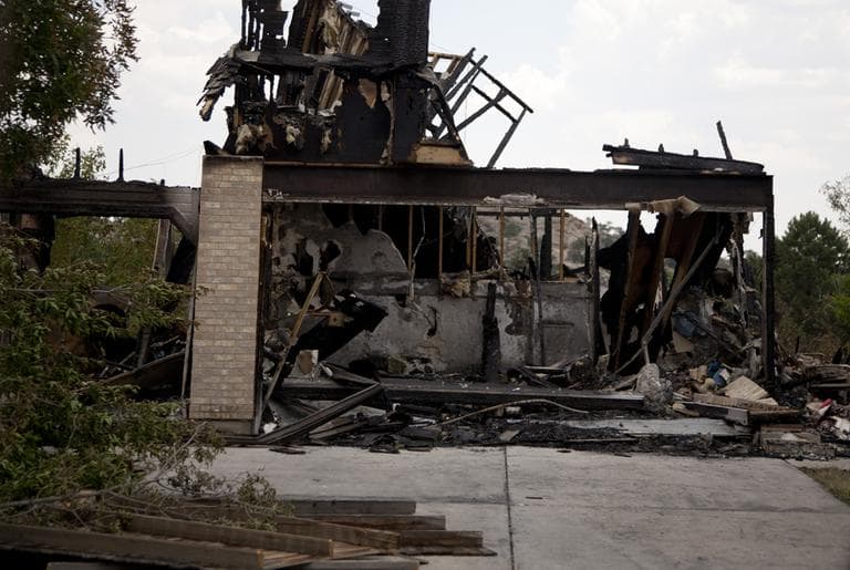 What is left of a burned home in the Mountain Shadow neighborhood, devastated by raging wildfires, Friday, June 29 in, Colorado Springs, Colo. (AP)