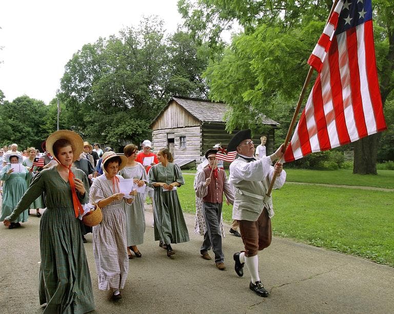 Period interpreters lead the citizen's parade during an Independence Day celebration at Lincoln's New Salem State Historic Site near Petersburg, Ill. (AP)