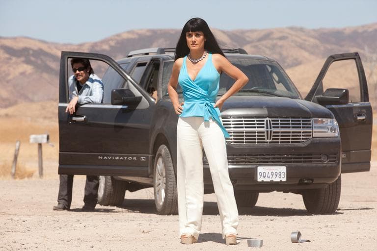 Actors Benicio Del Toro, left, and Salma Hayek in a scene from the film "Savages," based on the book by Don Winslow. (AP/Universal Pictures, Francois Duhamel)