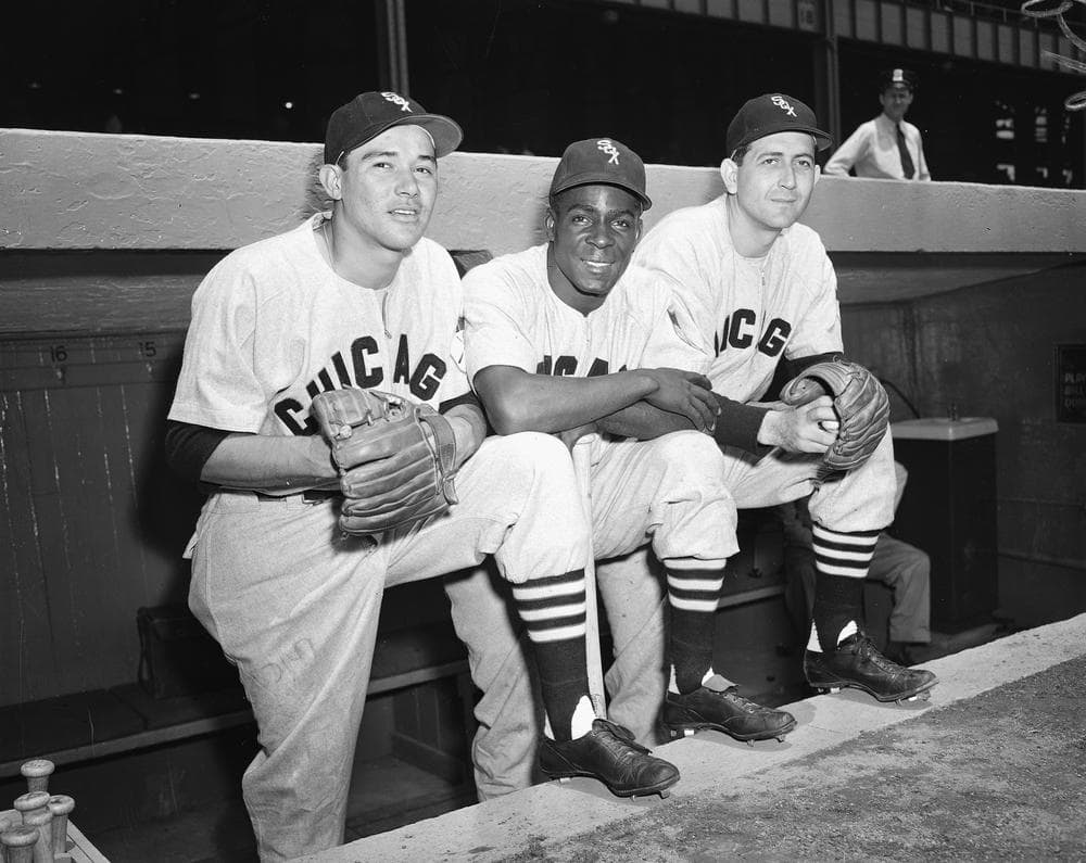 Minnie Minoso, shown here in 1951 with Chicago teammates Chico Carrasquel and Luis Aloma, played in the major leagues in five different decades. (AP)