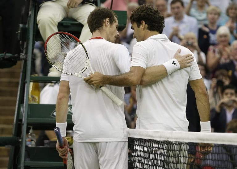 Andy Murray of Britain, left, congratulates Roger Federer of Switzerland after he won the men's singles final match at the All England Lawn Tennis Championships at Wimbledon, England, Sunday. (AP)