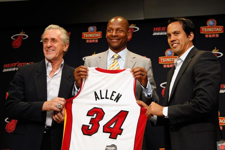 From left: Miami Heat president Pat Riley, Ray Allen and head coach Erik Spoelstra hold up Allen&#039;s jersey after the former Celtic signed a contract with the Heat Wednesday. (AP)