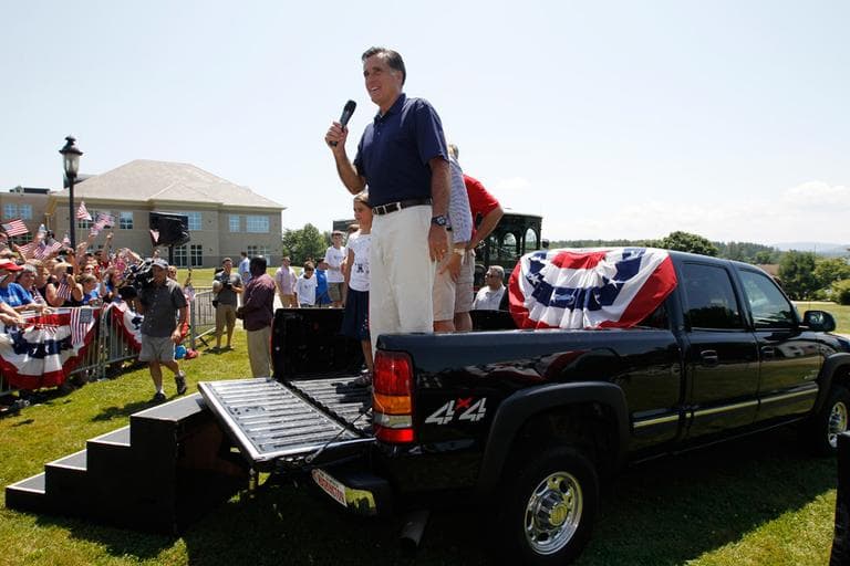 Mitt Romney speaks from the back of a pickup truck after he walked in the Fourth of July Parade in Wolfeboro, N.H. (AP)