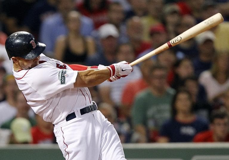 Red Sox&#039;s Cody Ross follows through on a three-run home run in the third inning on Wednesday. (AP Photo/Michael Dwyer)