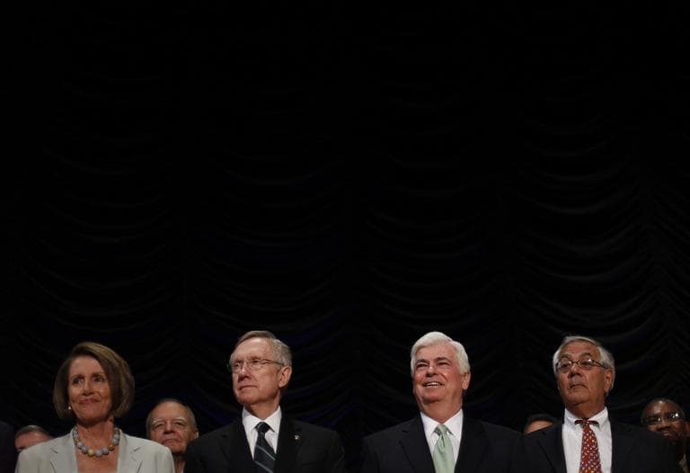 From left to right, Rep. Nancy Pelosi, Senate Majority Leader Harry Reid, Sen. Chris Dodd, and Rep. Barney Frank, on stage at the signing of the Dodd-Frank Wall Street Reform and Consumer Protection Act in 2010. (AP)
