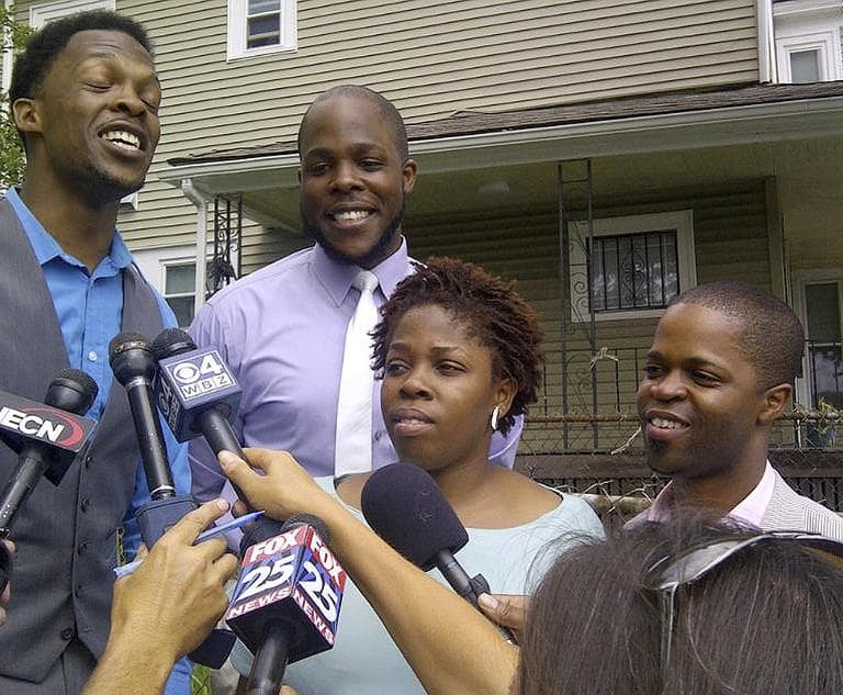 Children of the Rev. Michel Louis, from left: Daniel Louis,, Nathaniel Louis, Debora Luois, and Jean Louis, speak to the media in Boston after talking to their father via satellite phone from Egypt following his release Monday.  (AP)