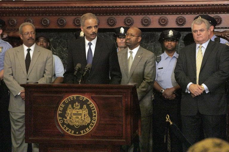 Attorney General Eric Holder addresses the media at Philadelphia City Hall on Monday after Holder announced more than $111 million in funding for more than 800 law enforcement positions across the country, including 44 in cities in Pennsylvania, through the U.S. Department of Justice Office of Community Oriented Policing Services. (AP)