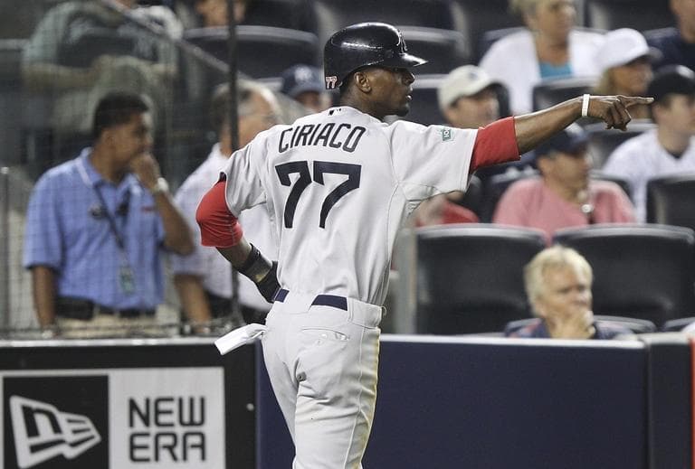 Red Sox's Pedro Ciriaco gestures after scoring on a sacrifice fly by Dustin Pedroia during the ninth inning on Saturday, July 28, 2012. (AP/Seth Wenig)