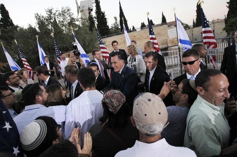 Republican presidential candidate and former Massachusetts Gov. Mitt Romney greets audience members after he delivered a speech in Jerusalem, on Sunday, July 29, 2012. (AP Photo/Charles Dharapak)