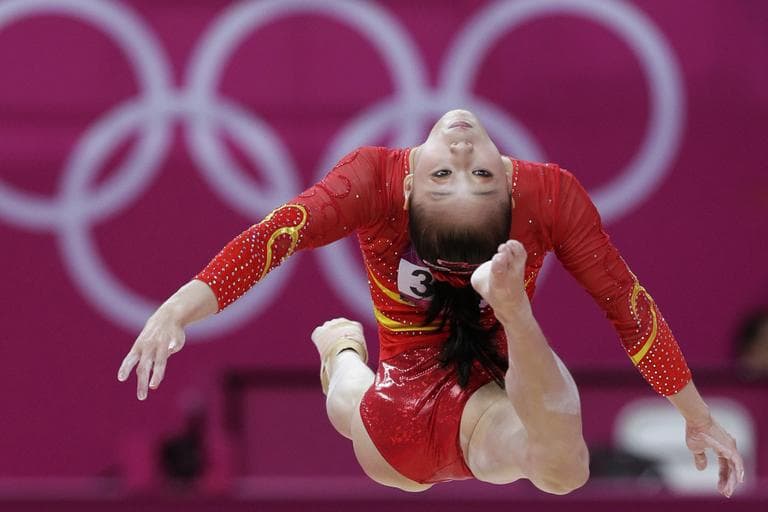 Chinese gymnast Sui Lu performs on the balance beam during the Artistic Gymnastic women's qualifications at the 2012 Summer Olympics, Sunday, July 29, 2012, in London. (AP)