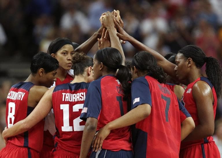 Team USA gather at half court after beating Australia during a women's semifinals basketball game at the 2012 Summer Olympics on Thursday. They will play in the Gold Medal Game on Saturday. (AP Photo/Charles Krupa)