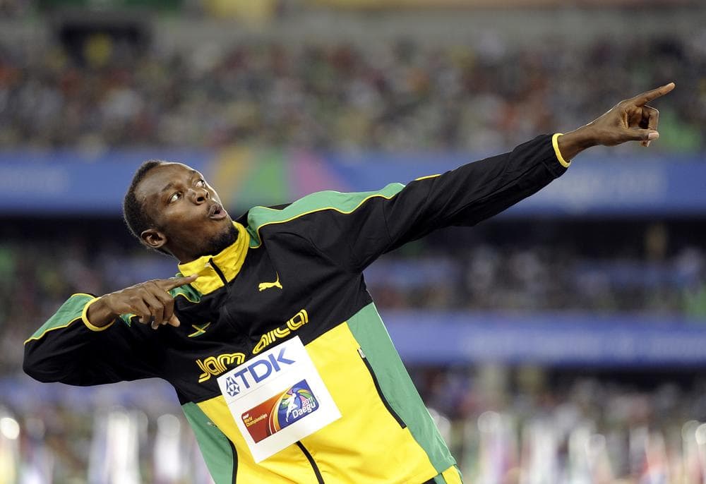 Jamaica's Usain Bolt posing on the podium after the Jamaican team won the gold and set a new world record in the men's 4x100m relay final at the World Athletics Championships in Daegu, South Korea. (AP)