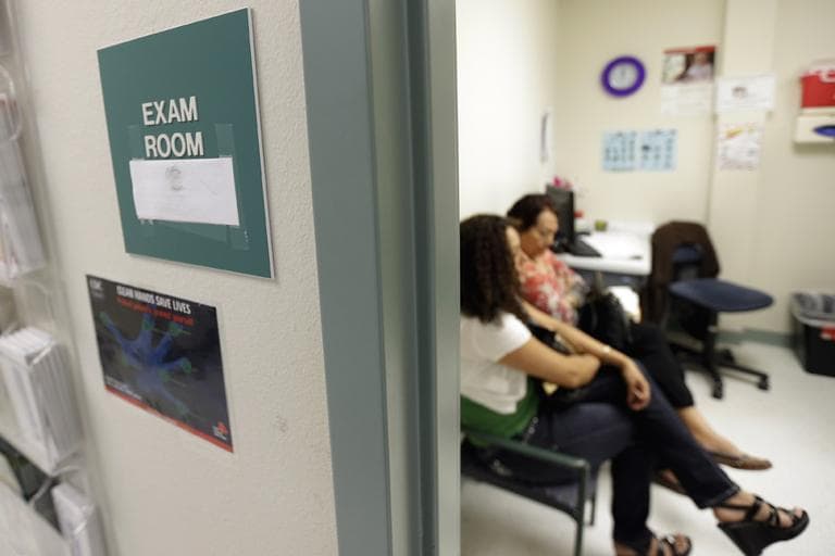 In this July 12, 2012 photo, two women wait in an exam room at Nuestra Clinica Del Valle, in San Juan, Texas. About 85 percent of those served at the clinic are uninsured. Texas already has one of the nation’s most restrictive Medicaid programs, offering coverage only to the disabled, children and parents who earn less than $2,256 a year for a family of three. Without a Medicaid expansion, the state’s working poor will continue relying on emergency rooms _ the most costly treatment option _ instead of primary care doctors. The Texas Hospital Association estimates that care for uninsured patients cost hospitals in the state $4.5 billion in 2010. (AP)
