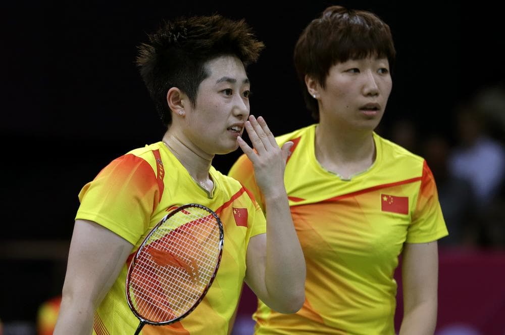 Eight Olympic badminton players, including China's Yu Yang, left, and Wang Xiaoli, were disqualified for tanking matches to get more favorable tournament positions. (AP)