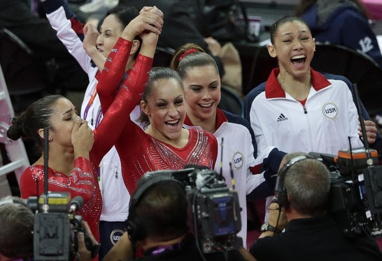 U.S. gymnasts, from left to right, Alexandra Raisman, Jordyn Wieber, McKayla Maroney and Kyla Ross celebrate after being declared winners of the gold medal during the Artistic Gymnastic women's team final at the 2012 Summer Olympics on Tuesday. (AP)