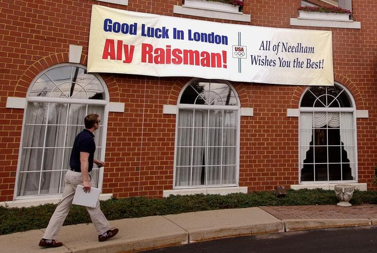 A sign hangs on a Needham building Wednesday with a message of support for U.S. gymnast Aly Raisman. (AP)