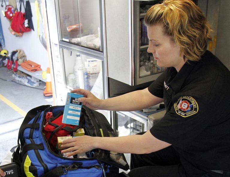 Salem fire department paramedic Jennifer Pratt checks over medications in an ambulance in Salem, Ore., Tuesday, July 10, 2012.  (AP Photo/Don Ryan)