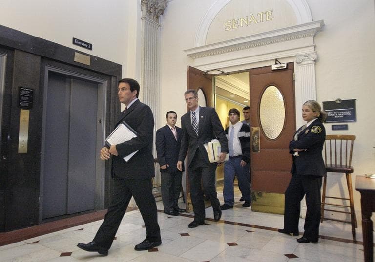 Richard Tisei, left, is followed by Sen. Scott Brown, as they leave the Senate Chambers in 2009. (AP)