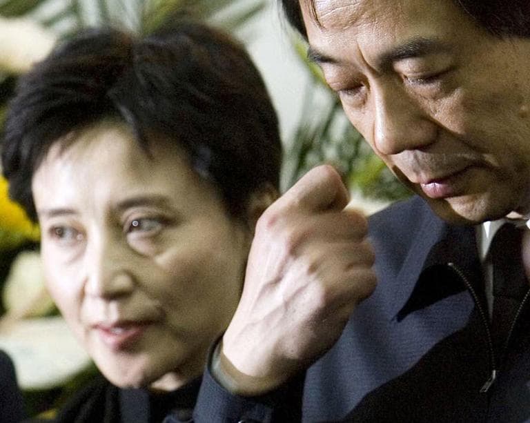 In this Jan. 17, 2007 file photo, Gu Kailai, left, wife of then Chinaese Commerce Minister Bo Xilai, right, attends a memorial ceremony for Bo's father. (AP)