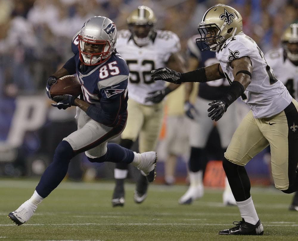 New England Patriots rookie wide receiver Brandon Lloyd  pulls away from New Orleans Saints strong safety Corey White after Lloyd caught a Tom Brady pass during their first preseason game last night. (AP Photo)