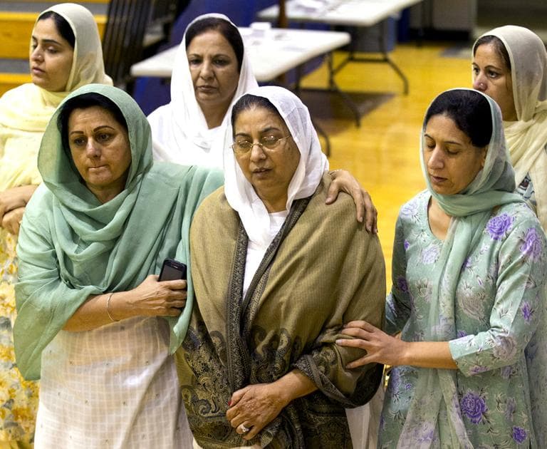 Mourners grieve at the funeral and memorial service for the six victims of the Sikh Temple of Wisconsin mass shooting in Oak Creek, Wis. (AP)