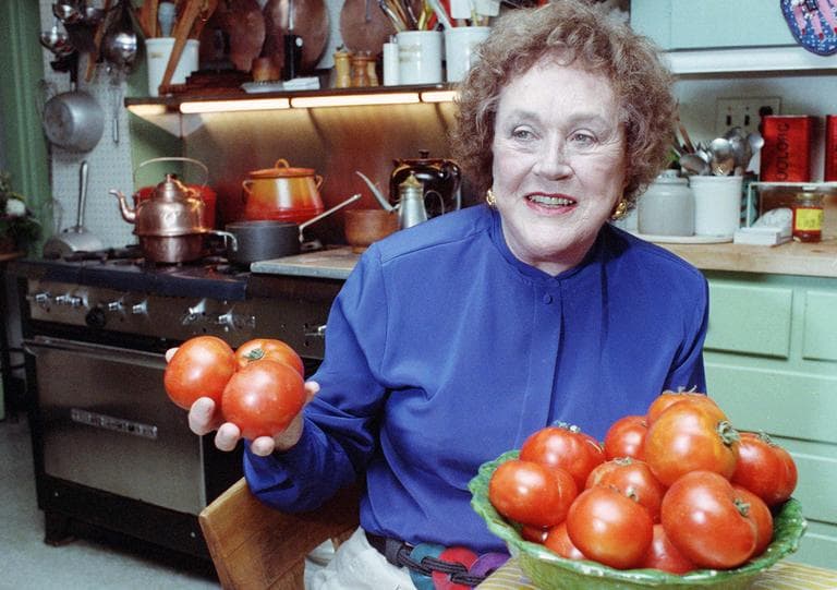 Chef Julia Child shows off tomatoes in the kitchen of her Cambridge home in 1992. (AP/File) 