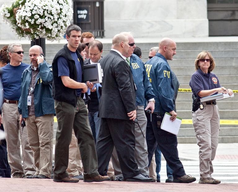 Washington Police and FBI agents gather outside the Family Research Council in Washington, Wednesday, after a security guard at the lobbying group was shot. (AP)