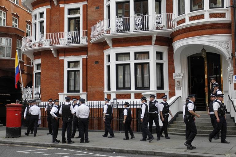 British police officers stand guard outside the Ecuadorian Embassy in central London, Thursday. (AP)