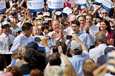 Republican presidential candidate Mitt Romney, left, introduces vice presidential candidate, Rep. Paul Ryan, on Monday at Saint Anselm College in Manchester, N.H. (AP Photo/Cheryl Senter)