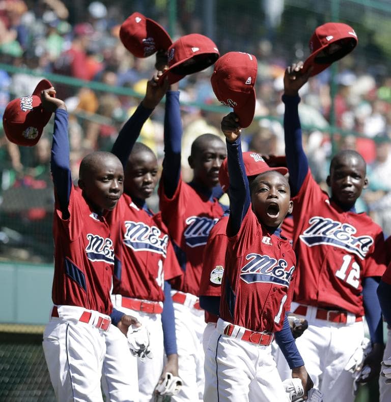 Lugazi, Uganda's Tom Agaku, second from right, and teammates cheer after Uganda won a consolation baseball game 3-2 against Gresham, Ore. at the Little League World Series in South Williamsport, Pa. (AP)