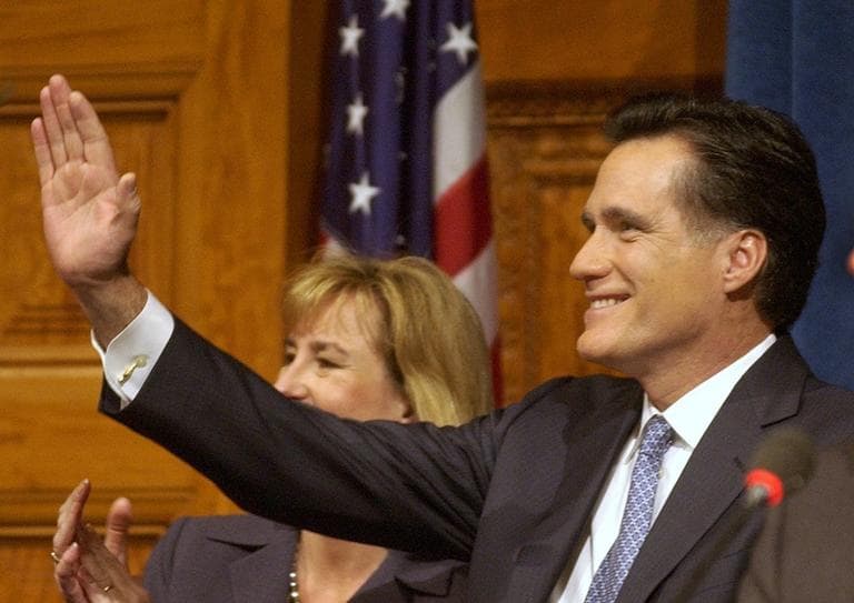 Massachusetts Gov. Mitt Romney waves after he and Lt. Gov. Kerry Murphy Healey, background, took their oaths of office during inaugural ceremonies at the Statehouse in Boston Thursday, Jan. 2, 2003. (AP /Elise Amendola)