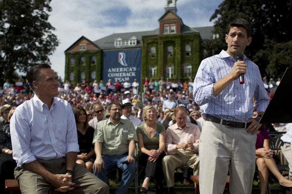 Republican presidential candidate Mitt Romney, left, looks on as vice presidential running mate Paul Ryan, speaks during a campaign rally on Mon., Aug. 20, 2012 in Manchester N.H. (AP Photo)