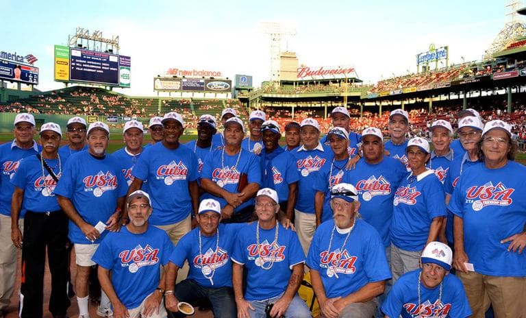 EMASS Softball has been sending teams to Cuba annually since 2009 for exhibitions called “The Friendship Games.” The teams posed for a photo after helping throw out the first pitch Saturday at Fenway Park. (Courtesy EMass Softball)