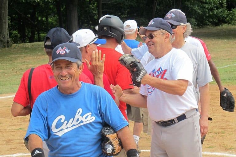 Wellesley resident Michael Eizenberg, right front, runs a business that offers cultural and educational trips. After organizing three EMASS Softball trips to Cuba, he coordinated the effort to bring a Cuban team to Boston. (Doug Tribou/WBUR)