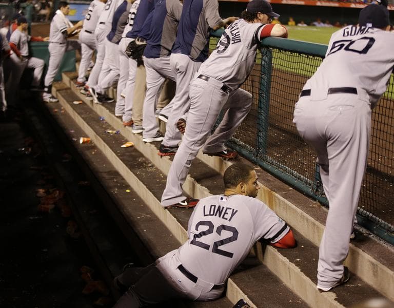 Boston Red Sox's James Loney watches the final inning of their baseball in the dugout against the Los Angeles Angels in Anaheim, Calif. Thursday. (2012)
