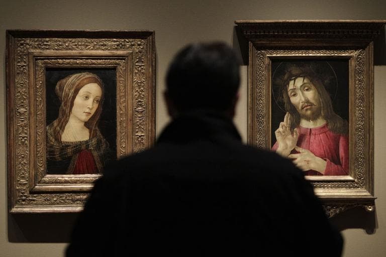 In an exhibition on forgeries at the Detroit Institute of Arts, a painting titled &quot;A Female Saint&quot;, left, that once was attributed to Italian artist Sandro Botticelli is exhibited alongside &quot;The Resurrected Christ,&quot; right, a Botticelli painting from around 1480. (AP)