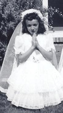 The author at her first communion. Despite her complicated feelings about the church, ironically, she has been cast four times in her acting career as a nun, most recently as Sister Ricarda in "The Three Stooges." (Photo courtesy of Marianne Leone)