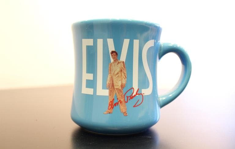 A mug commemorating Elvis Presley. The image of Elvis is property of the Elvis Presley Estate and managed by Elvis Presley Enterprises, Inc., a subsidiary of CKX, Inc.(Aayesha Siddiqui/WBUR)