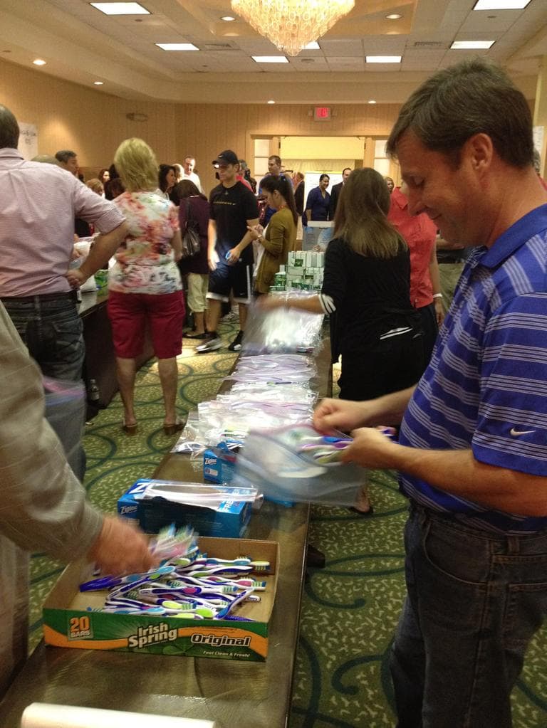 Mormon members of Utah's delegation crated hygiene bags for charity Monday at the RNC. (Meghan Keane/Here & Now)