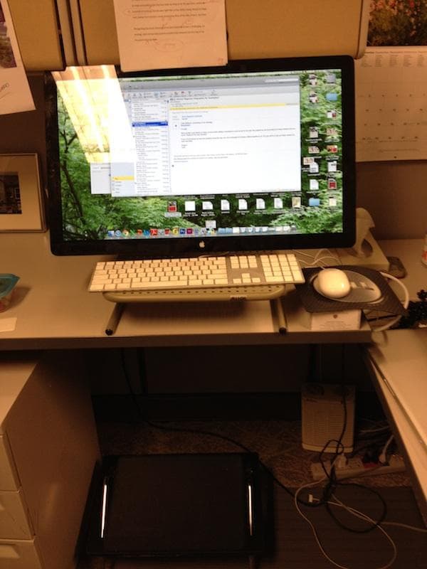 A raised desk with a "cheap-o laptop stand" added.