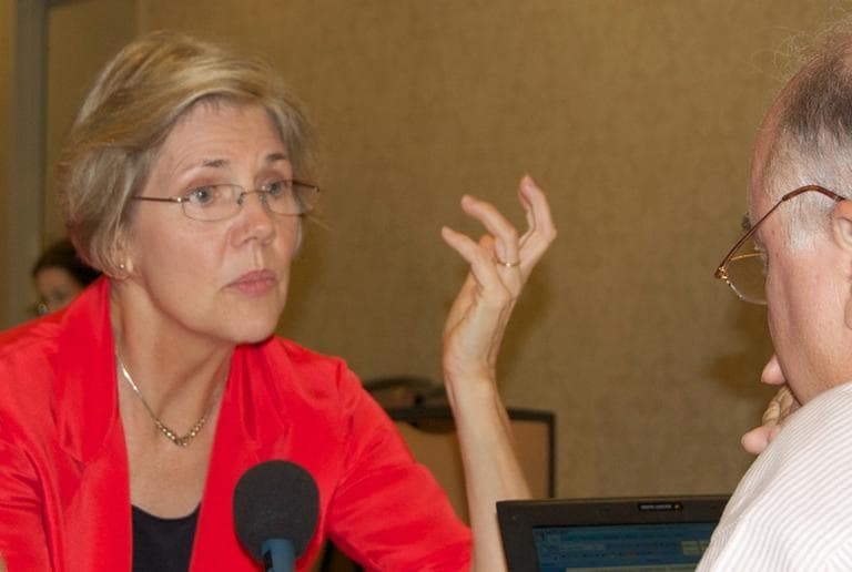 Senate candidate Elizabeth Warren talks to WBUR's Bob Oakes at the Democratic National Convention in Charlotte, N.C., Tuesday. (Tiffany Campbell/WBUR)