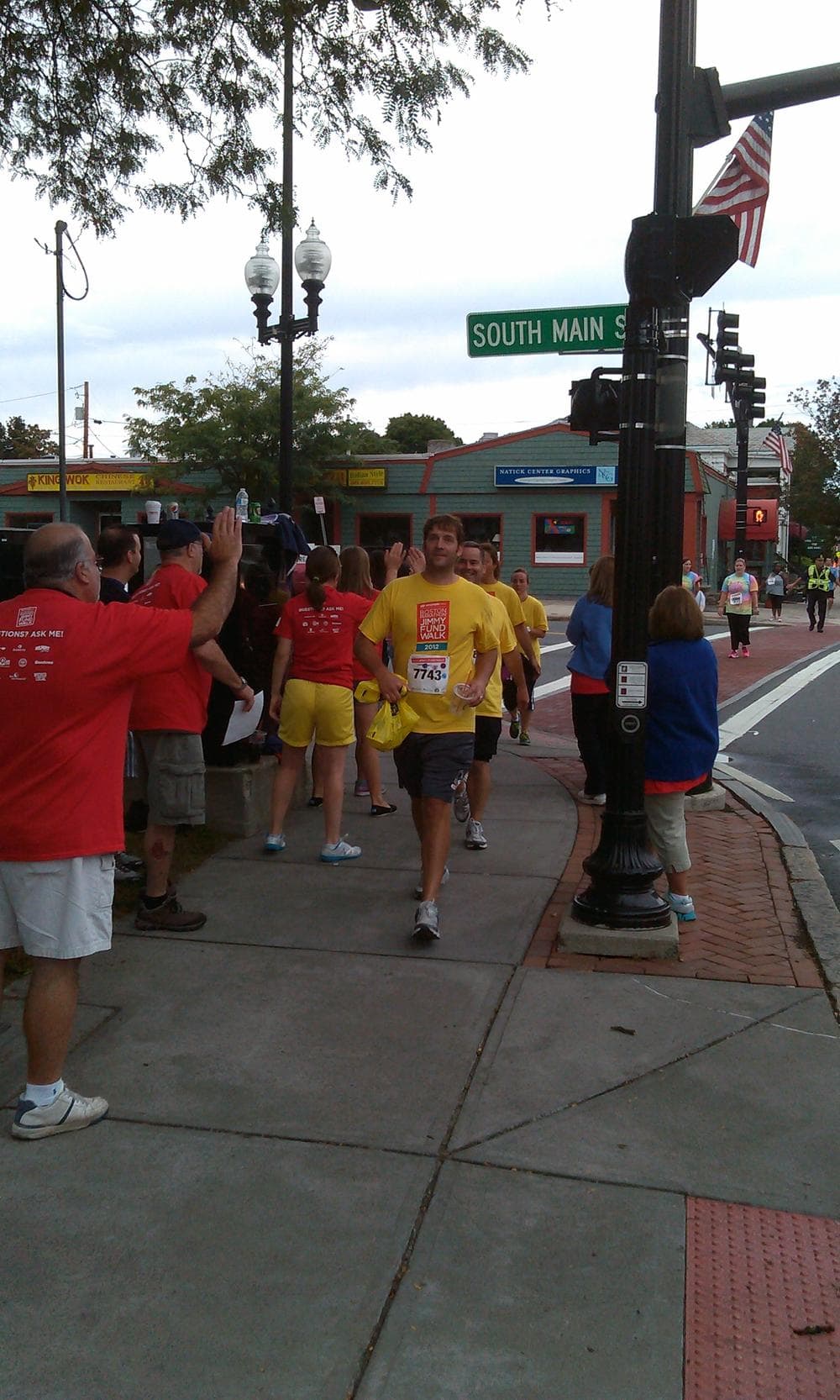 Participants of the 24th annual Boston Marathon Jimmy Fund Walk make their way through Natick on Sunday. (Alex Ashlock/WBUR)